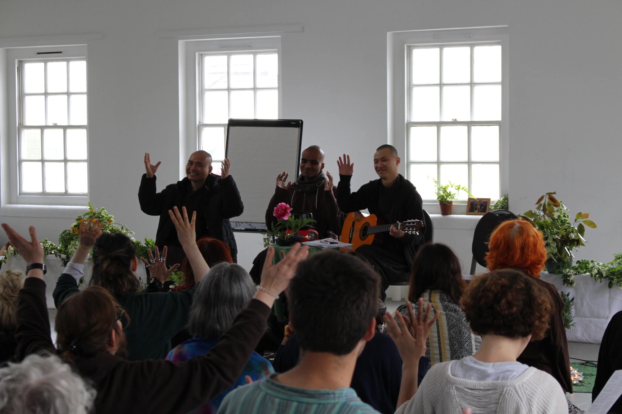 Monastic and practitioners at London hub