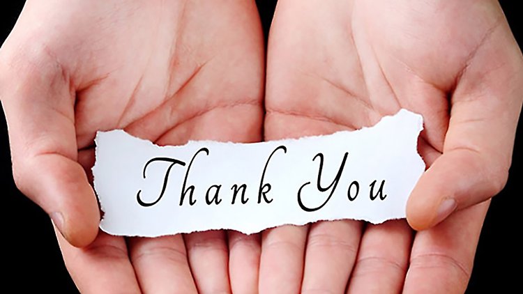 hands holding thank you note